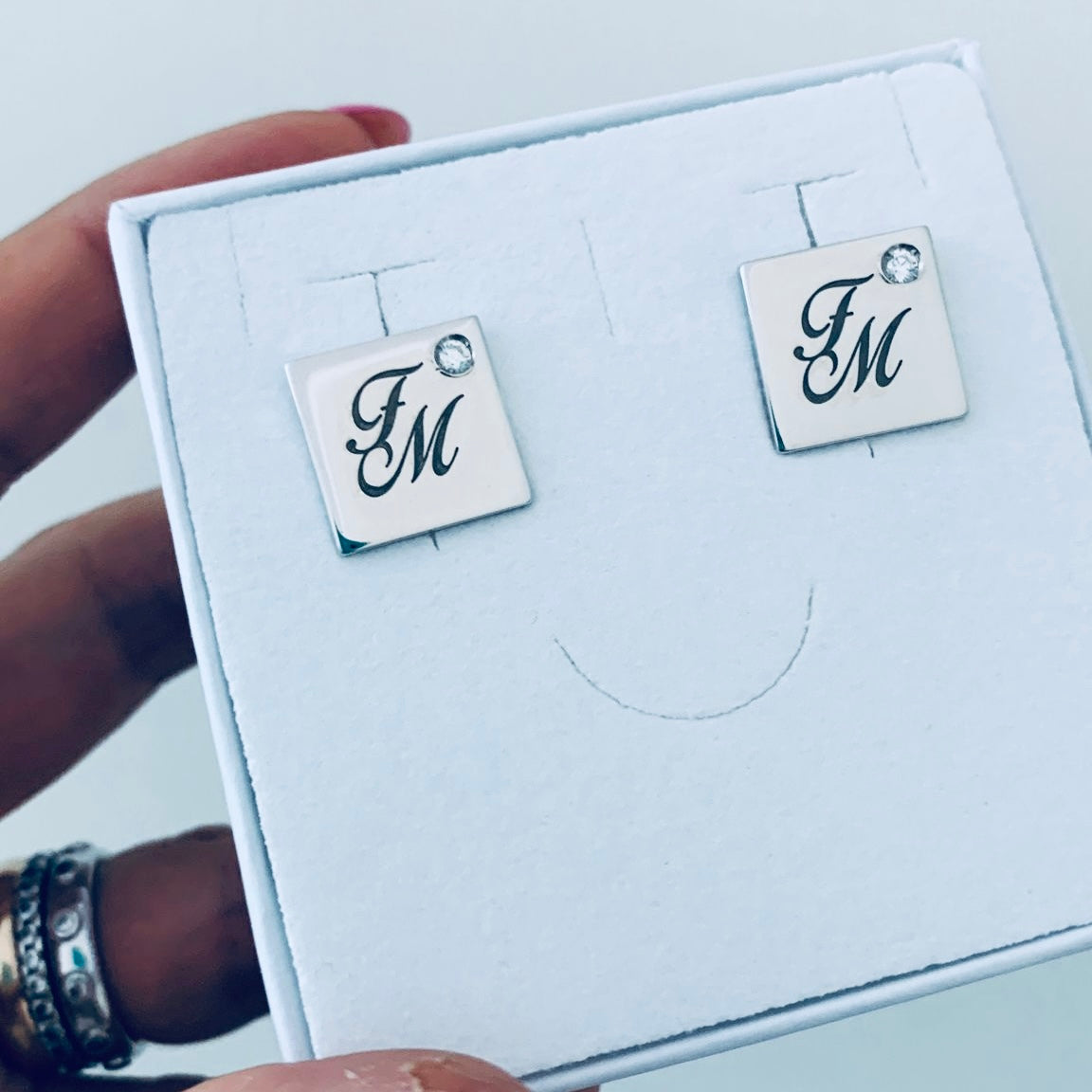 gemelli in argento 925 con incisione smaltata e zirconi punto luce. Rabiosa