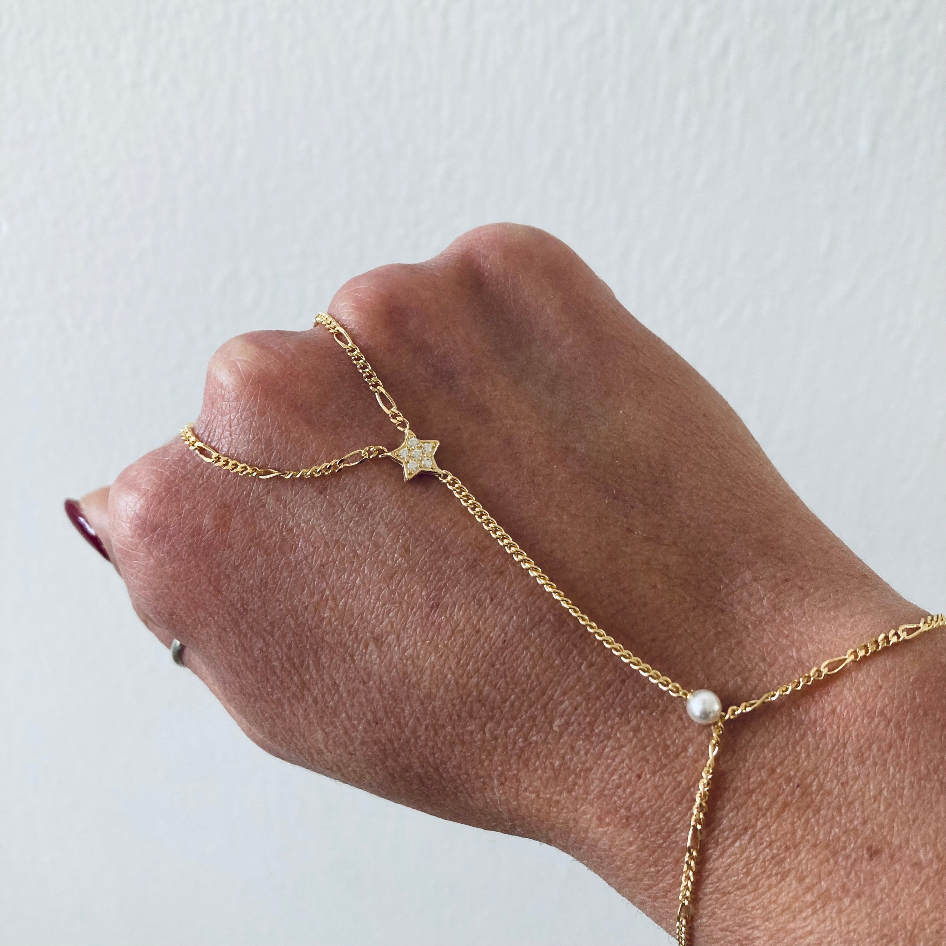 baciamano in argento 925 con stella in zirconi e perla. rabiosajewels.disponibile solo in versione oro